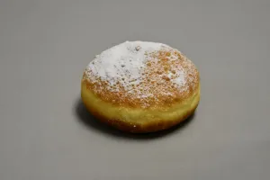 Bismark filled with custard, covered in powdered sugar