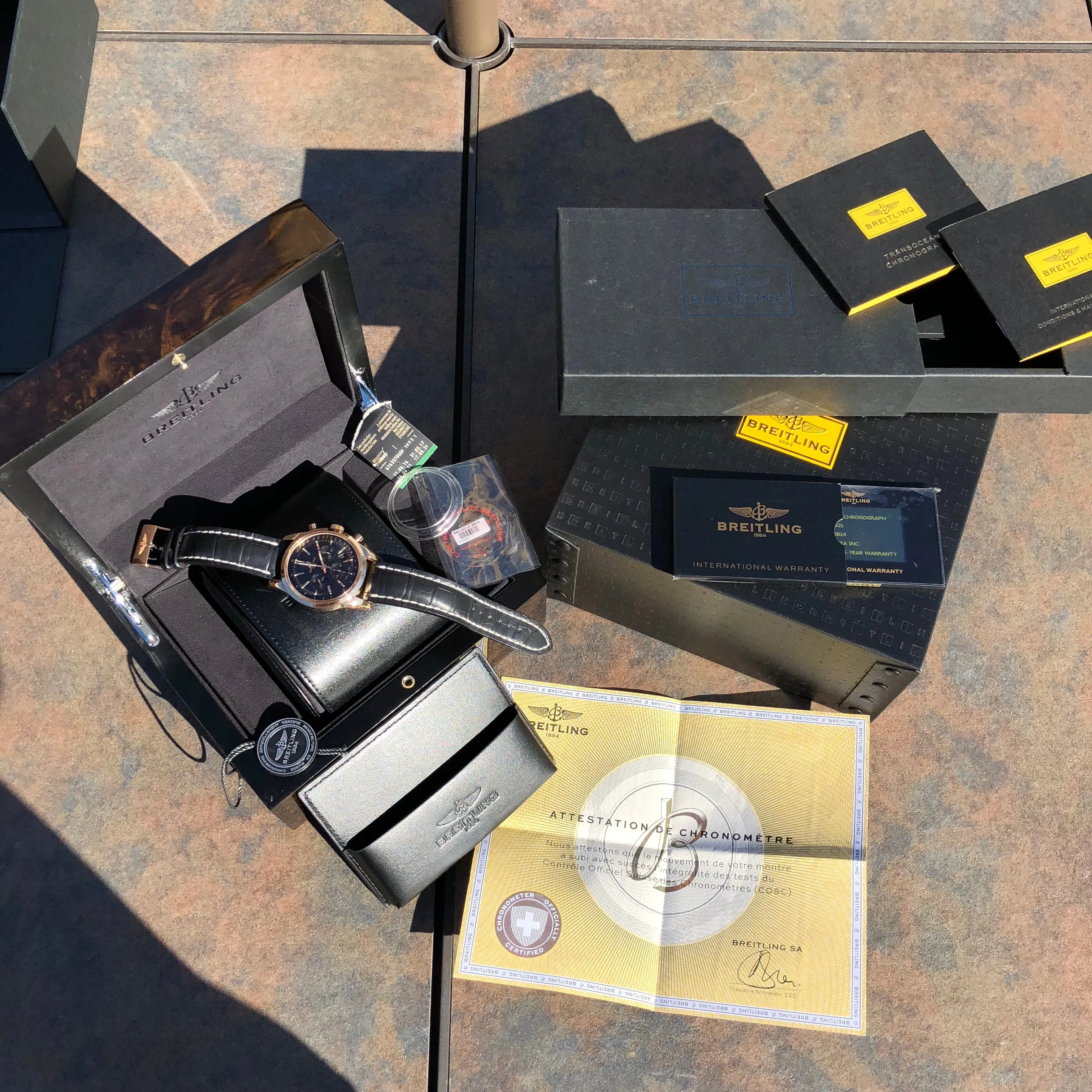 Breitling Transocean RB015212 18K Rose Gold Chronograph Black Dial Wristwatch Box Papers