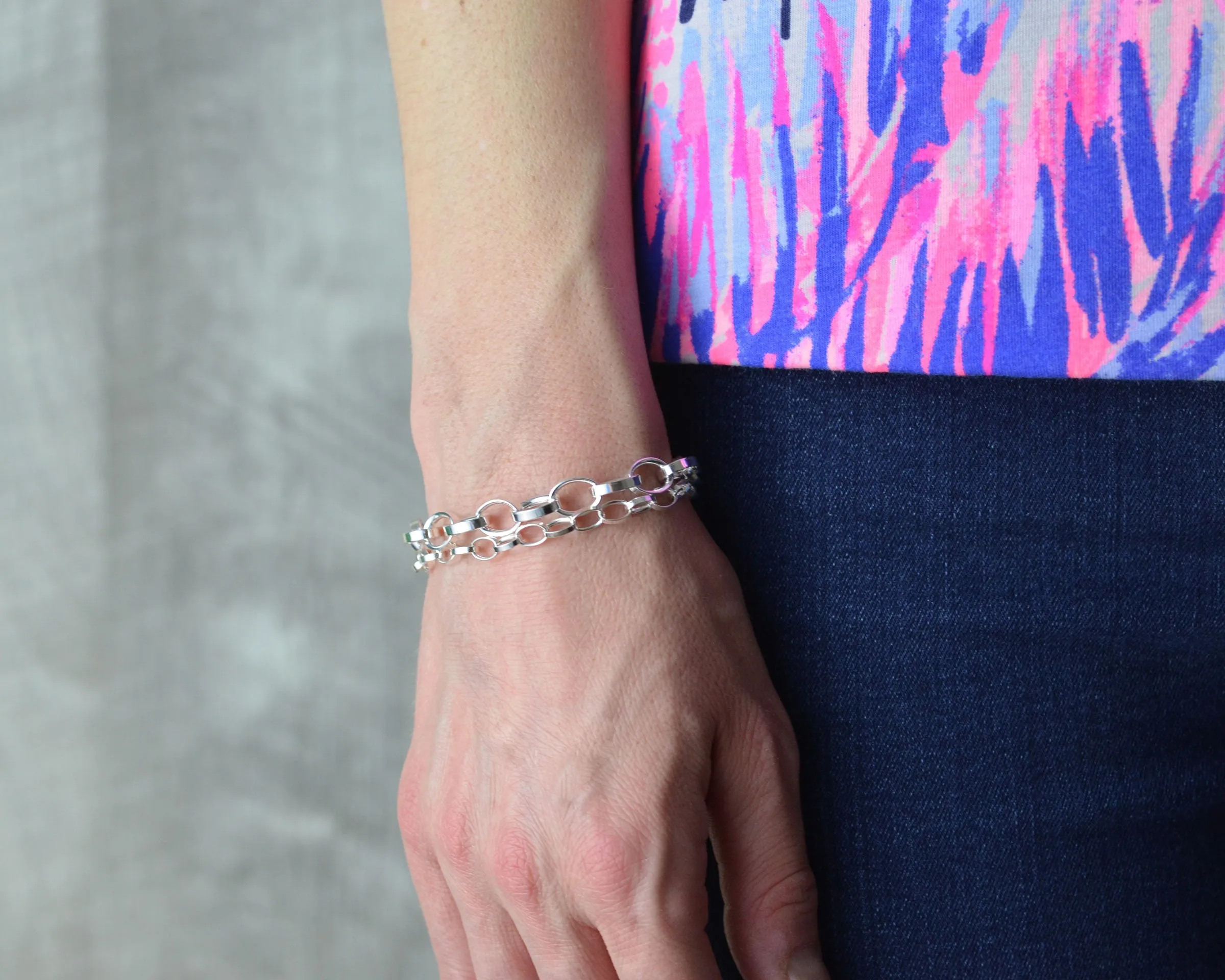 LAYERED CHUNKY SILVER CHARM BRACELET