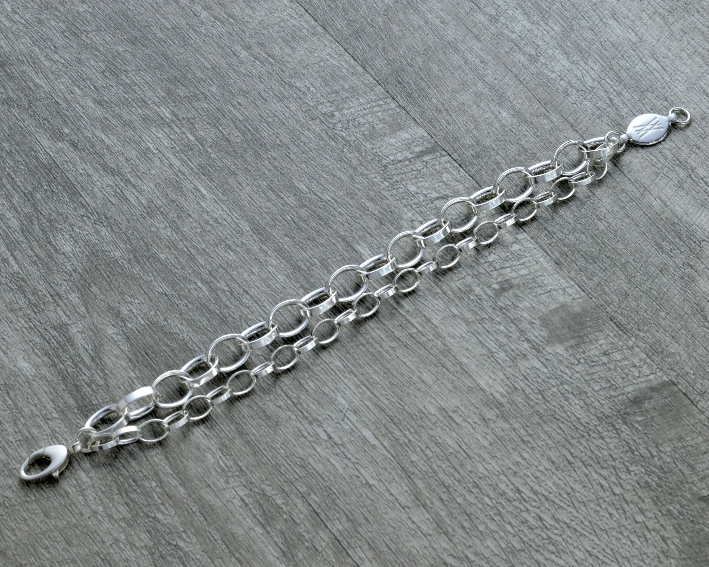 LAYERED CHUNKY SILVER CHARM BRACELET