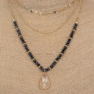 Long layered stone and crystal charm necklace