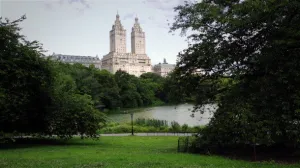 People Walk Near The Lake in Central Park NYC