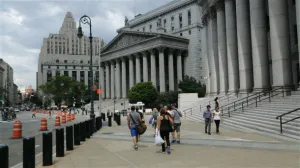 People Walking in Front of Court Buildings in NYC
