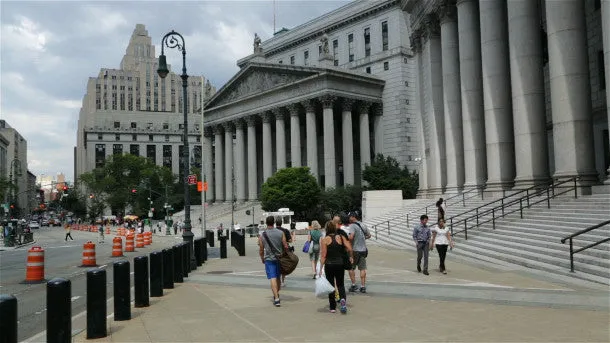 People Walking in Front of Court Buildings in NYC