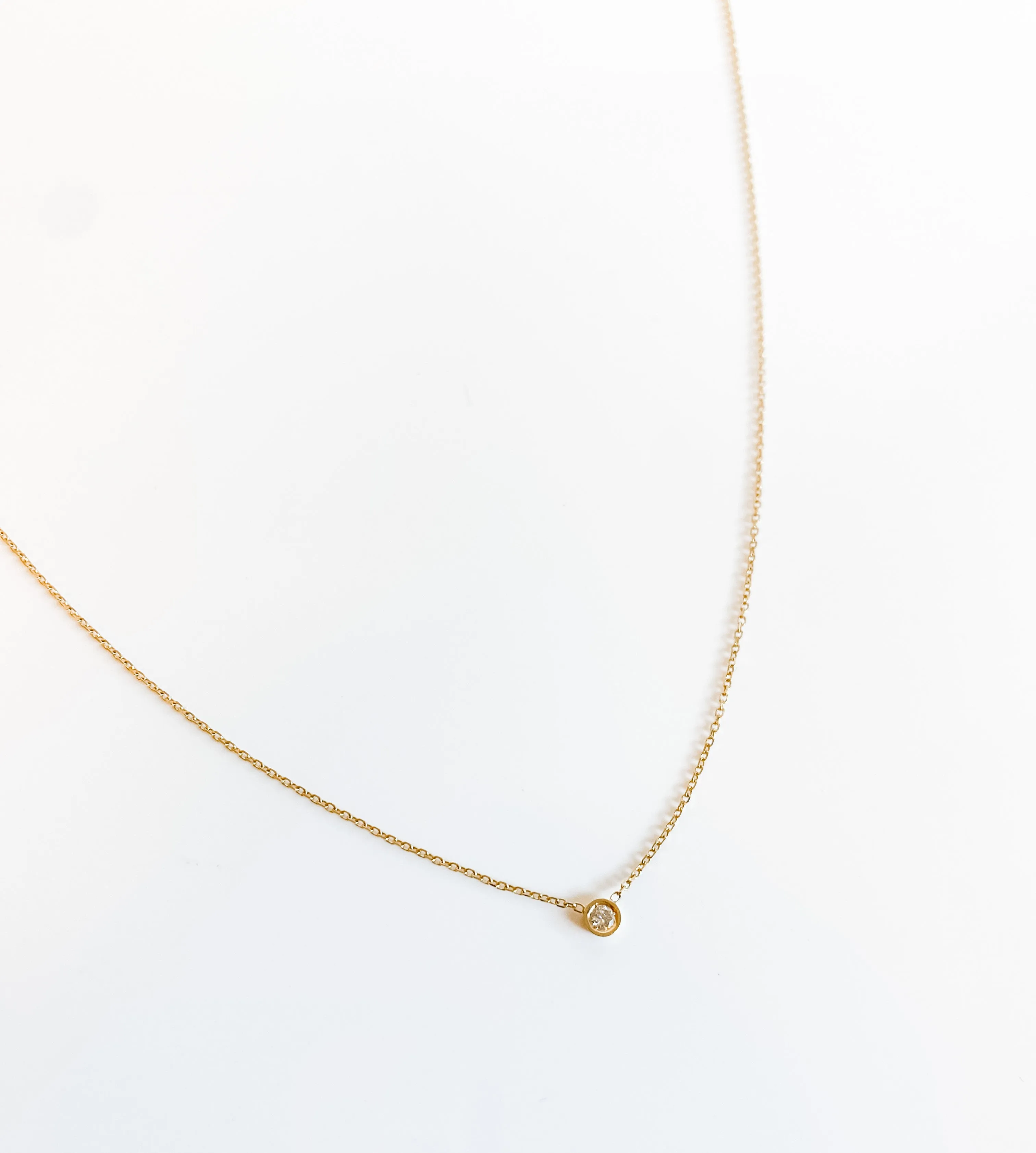 SOLID GOLD PETITE FLOATING DIAMOND