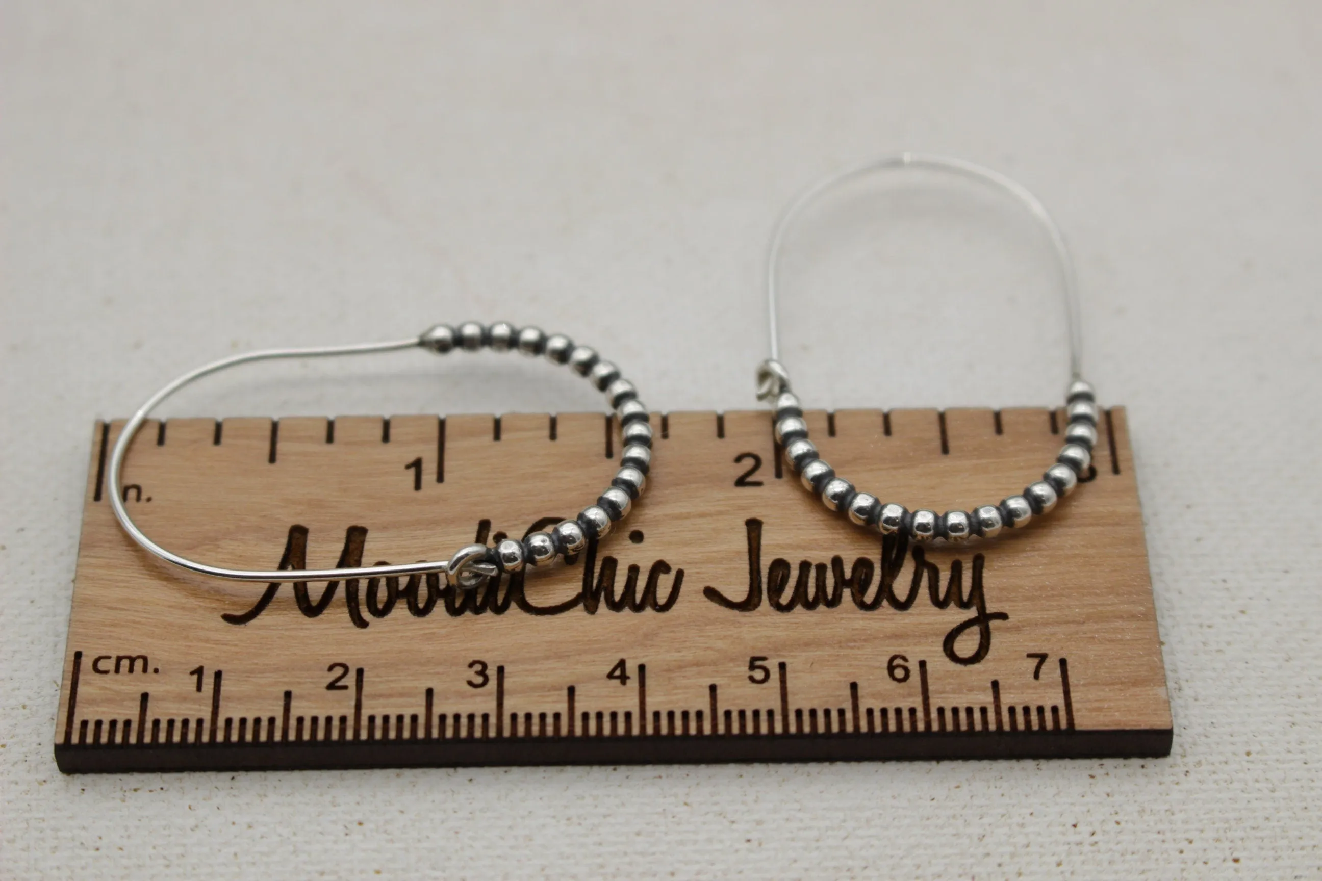Sterling silver beaded hoop earring