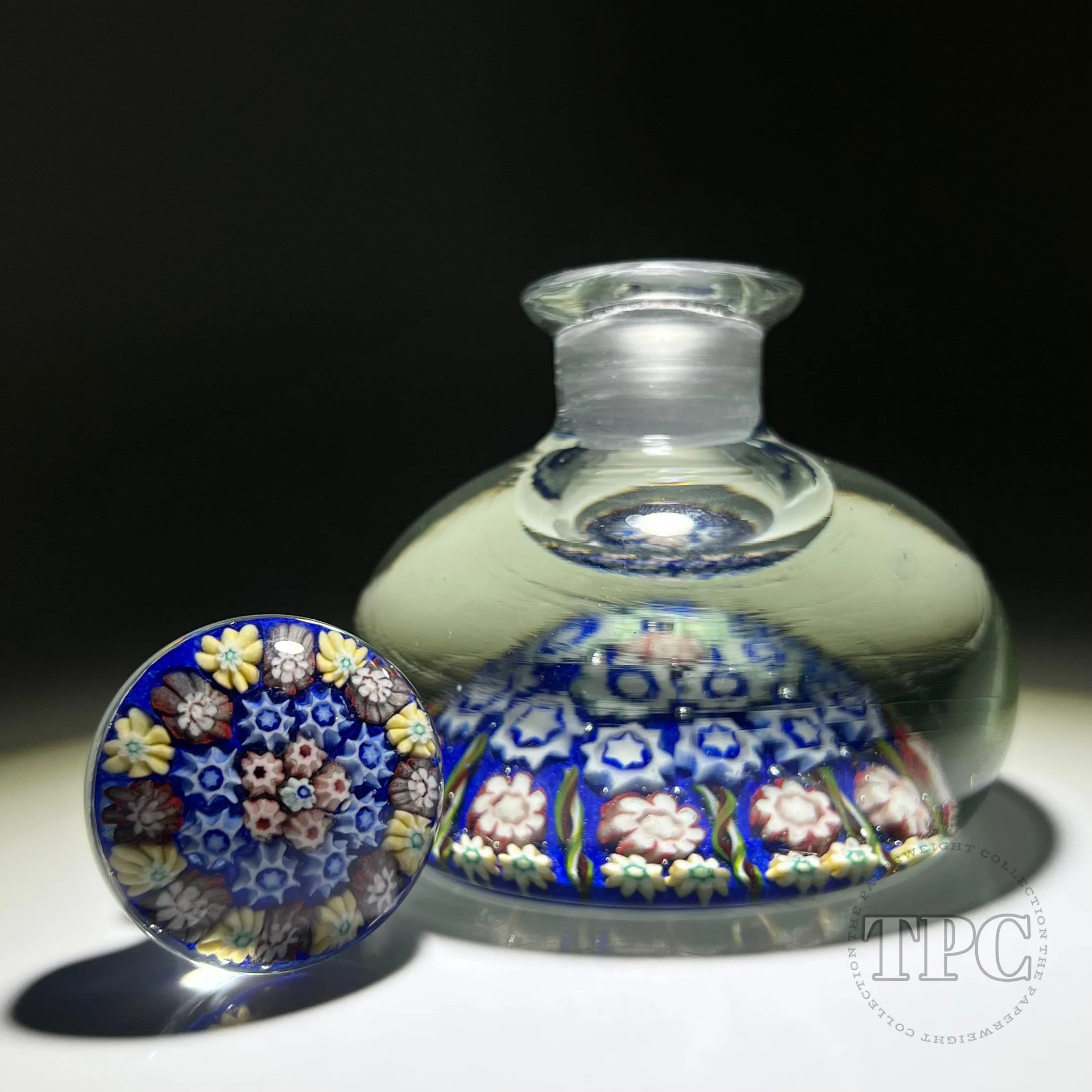 Vintage Vasart Glass Art Paperweight Style Bottle with Radial Ribbon Twists and Millefiori on Opaque Blue Ground